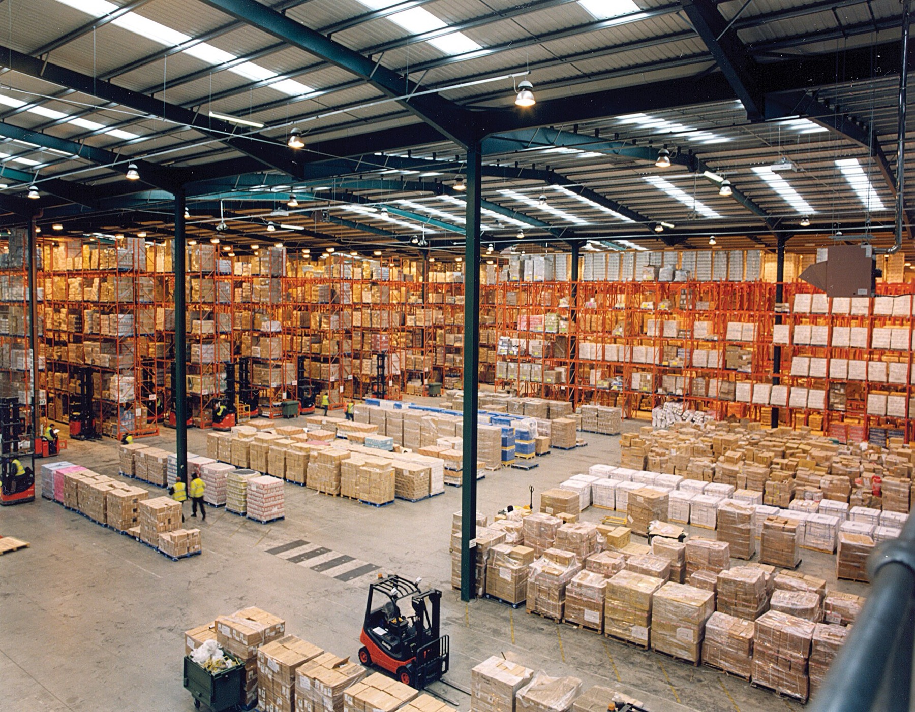 Cold storage warehouse stacked with cartons of produce