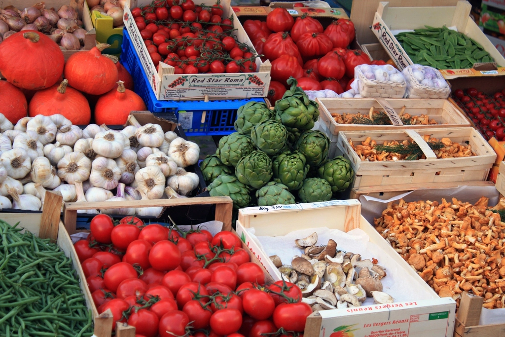 Crates of fresh vegetables at a wholesale produce market